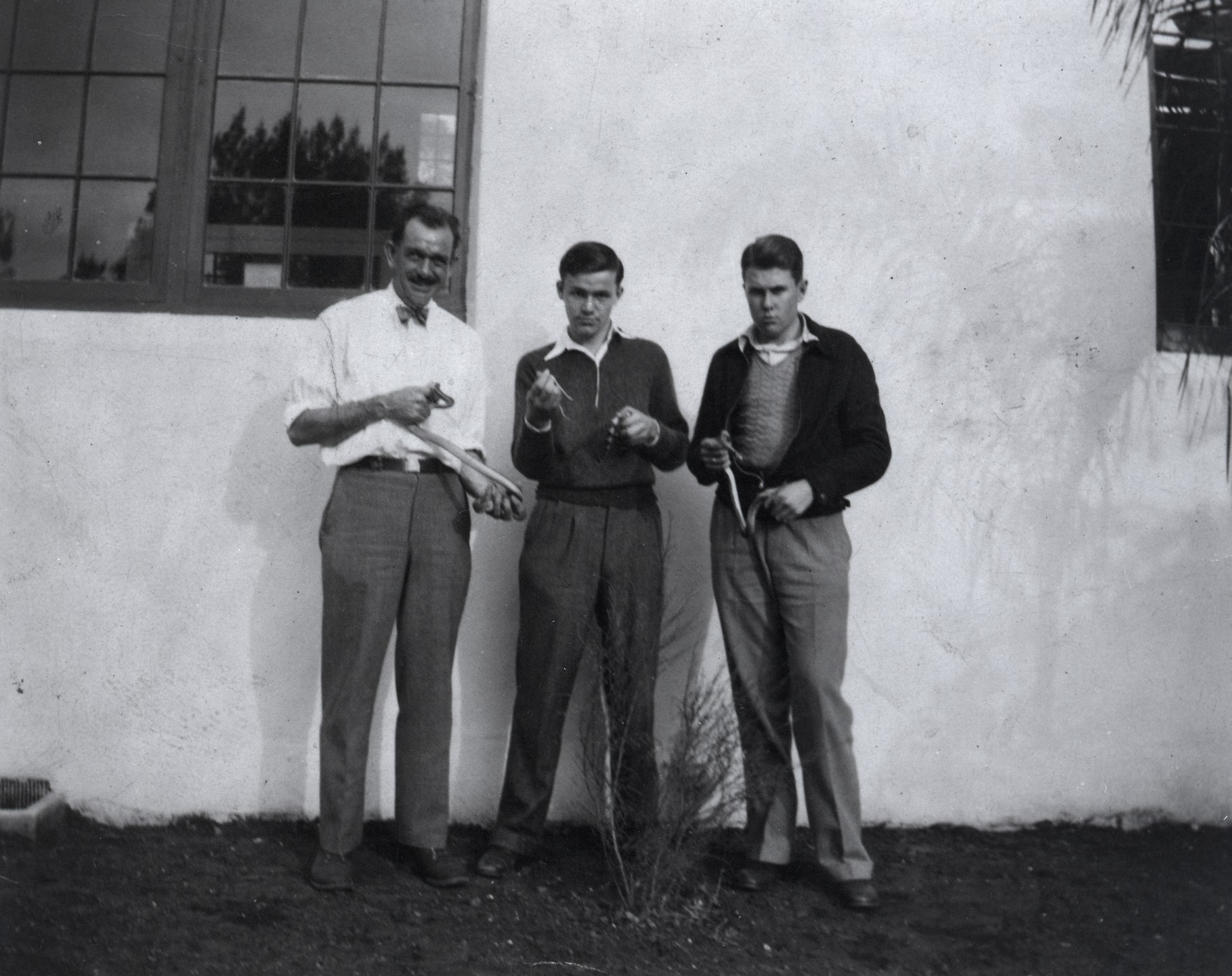 Reptile curator Si Perkins and young Sheldon Campbell and Chuck Shaw